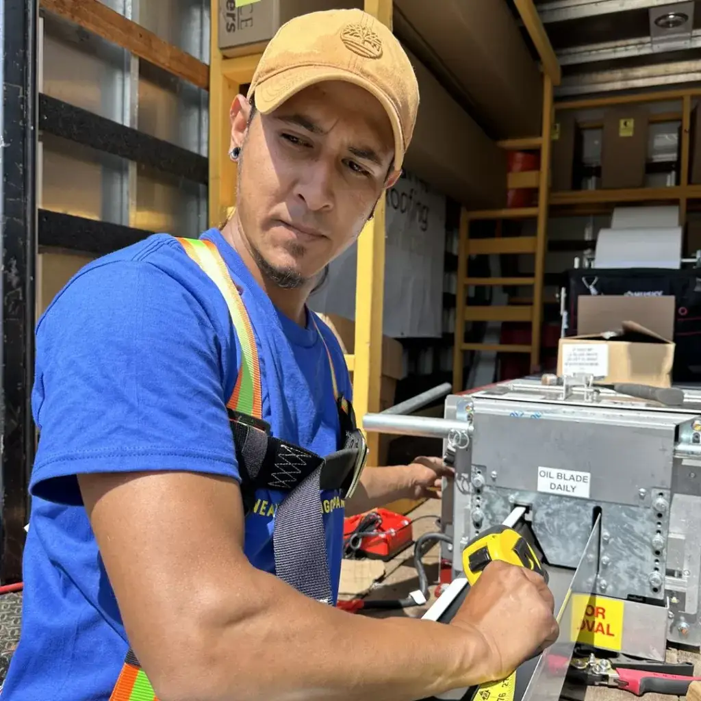 A man working in a NearMe Roofing Company truck