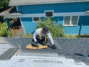 a man working on a roof in Bellevue, WA