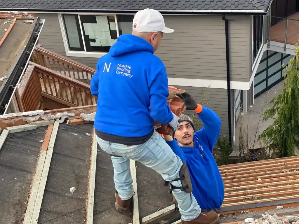 two men working on a roof