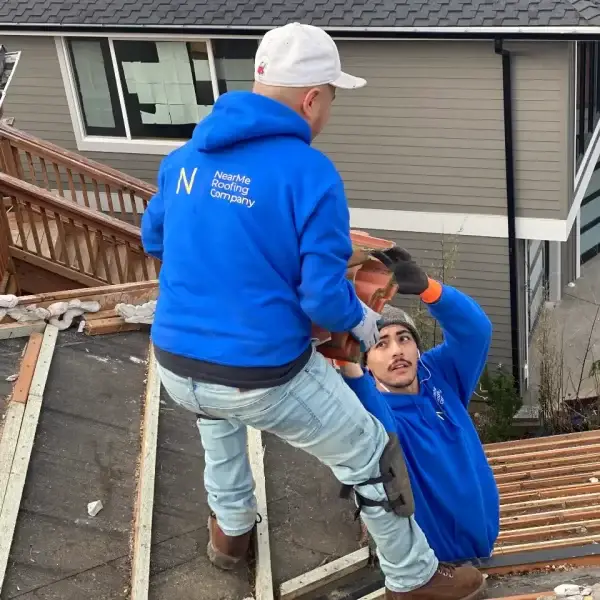 two men working on a roof