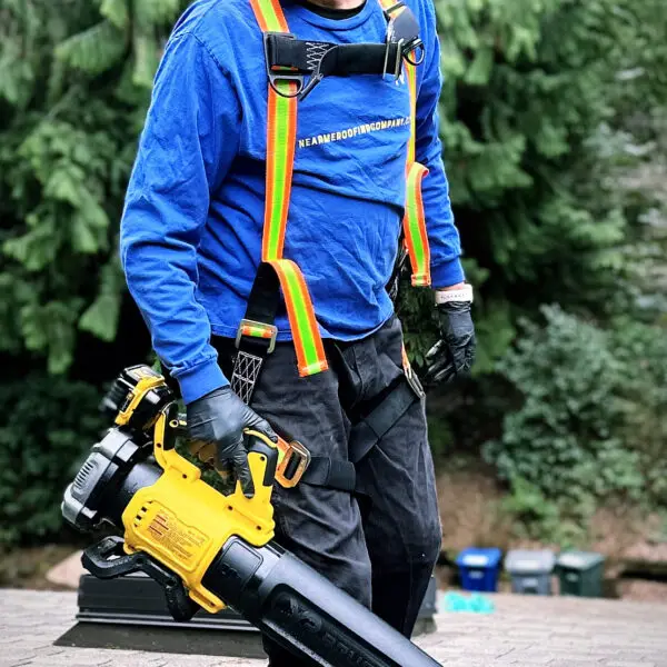 man cleaning a roof