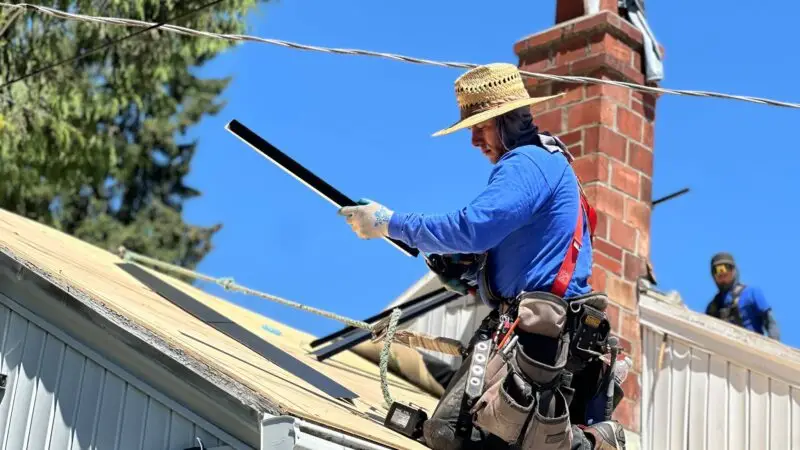 a man from nearme roofing company on a roof