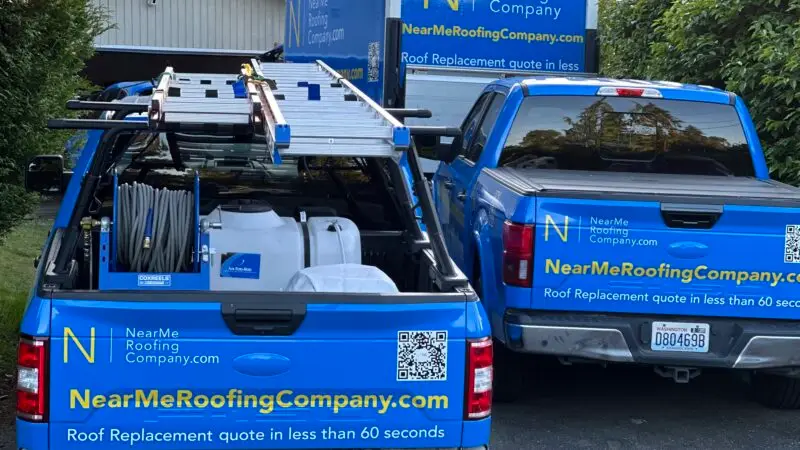 a group of nearme roofing company trucks parked in a driveway