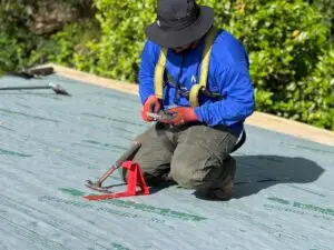 roofer working on a leaking roof