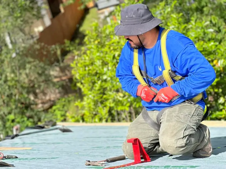 professional roof installer fixing a roof