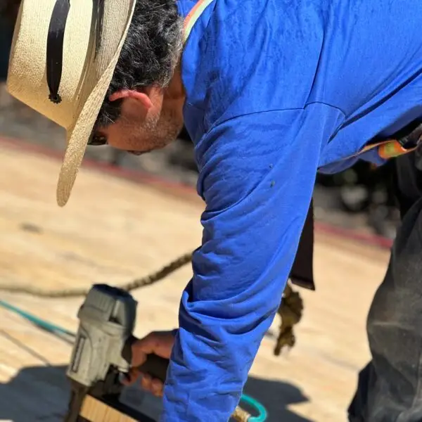 a man installing roof sheathing