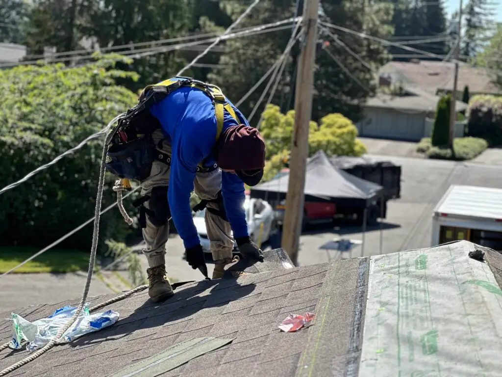 a man is fixing a roof