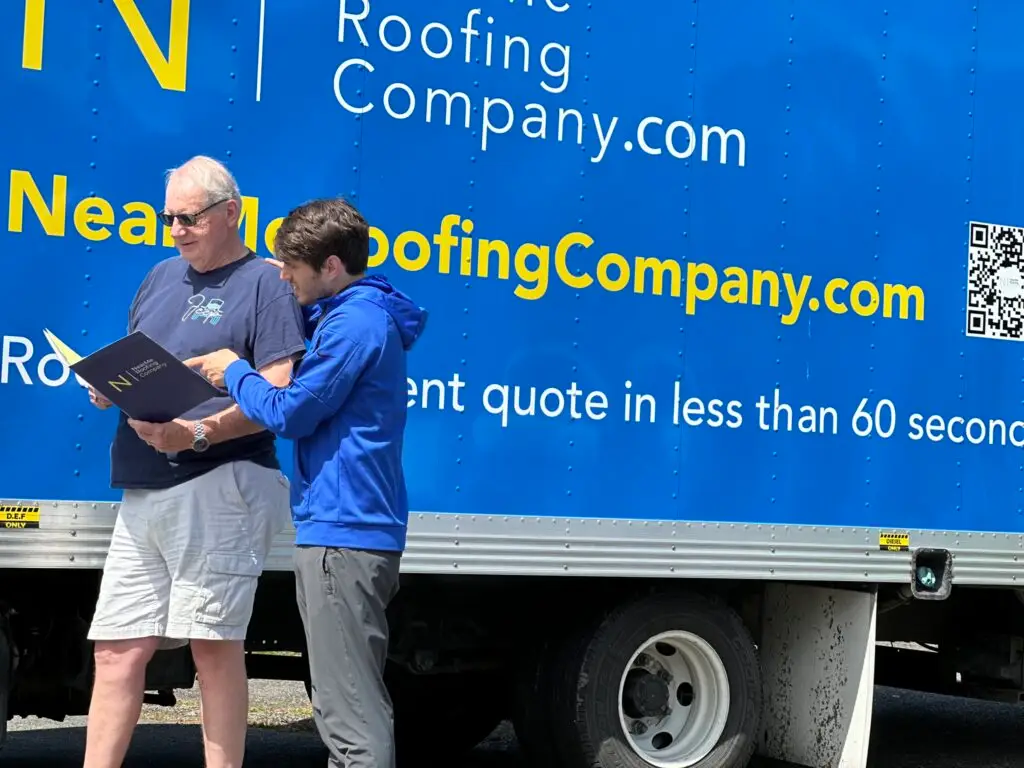 men discussing a roofing project