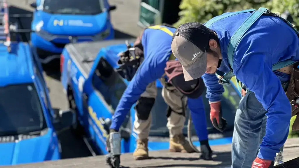 men installing starter shingles