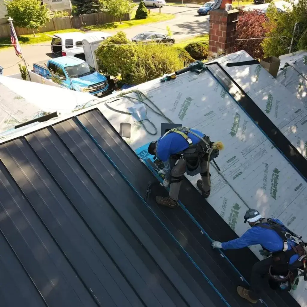 men installing a metal roof in Washington