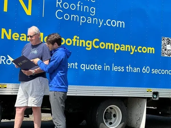 Near Me Roofing Contractor in Seattle discussing with a client