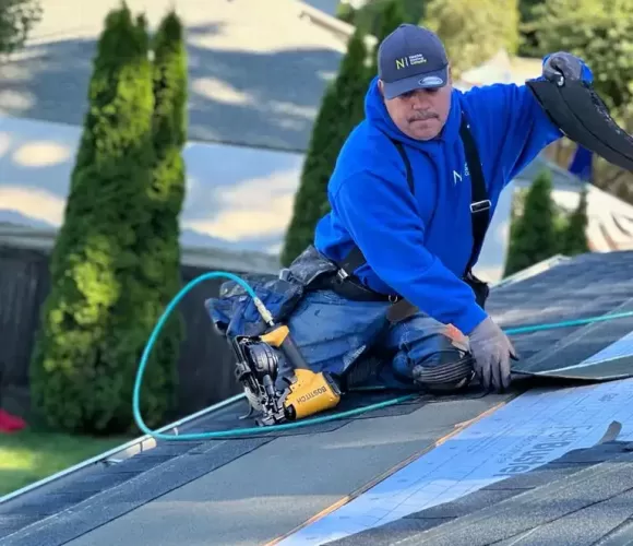 man working on a roof