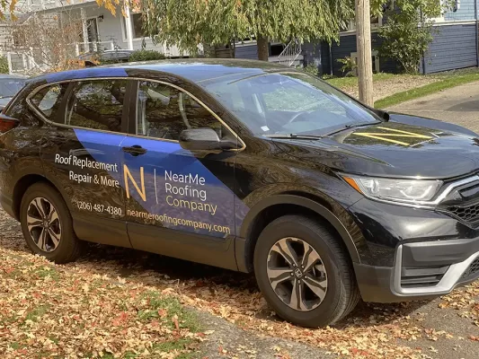 A parked Kirkland Roofing Company Van